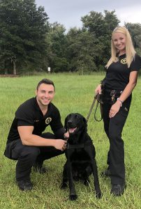 Heidi Sievers, pictured with her husband Austin and a Sheriff's Office K9