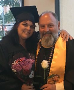 Tom Buzzerd congratulates his wife Teresa as she earns her bachelor's degree in 2018.